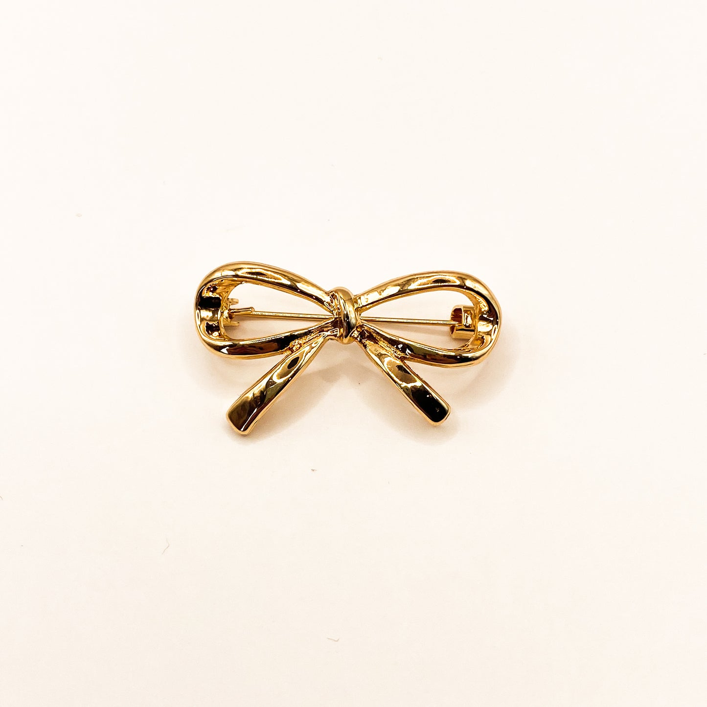 Strikje goud | Broche